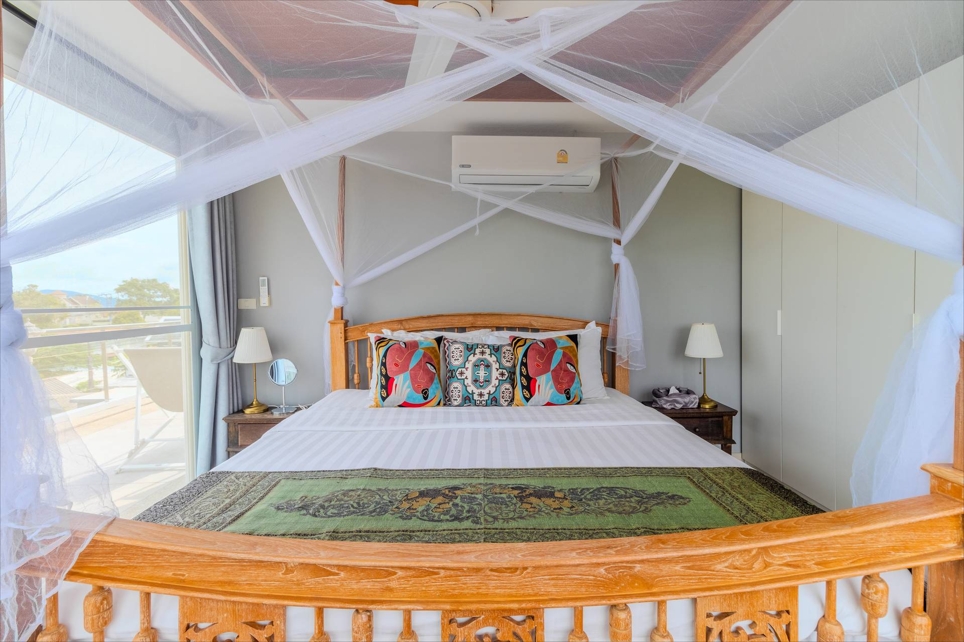 Romantic four-poster canopy bed with panoramic mountain views