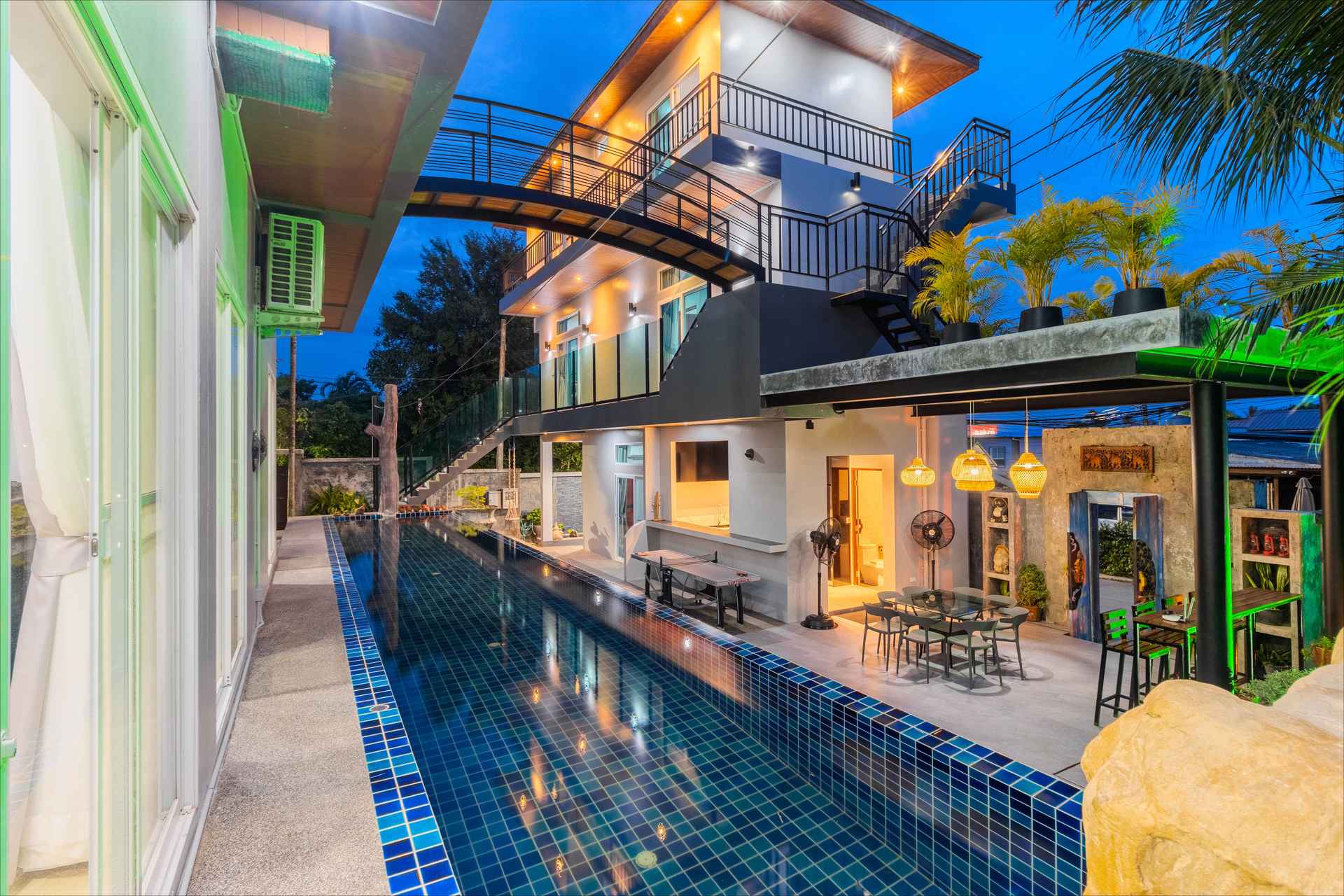 Spectacular 17-metre lap pool at Rawai Estate Villa with overhead zipline and tropical garden surroundings