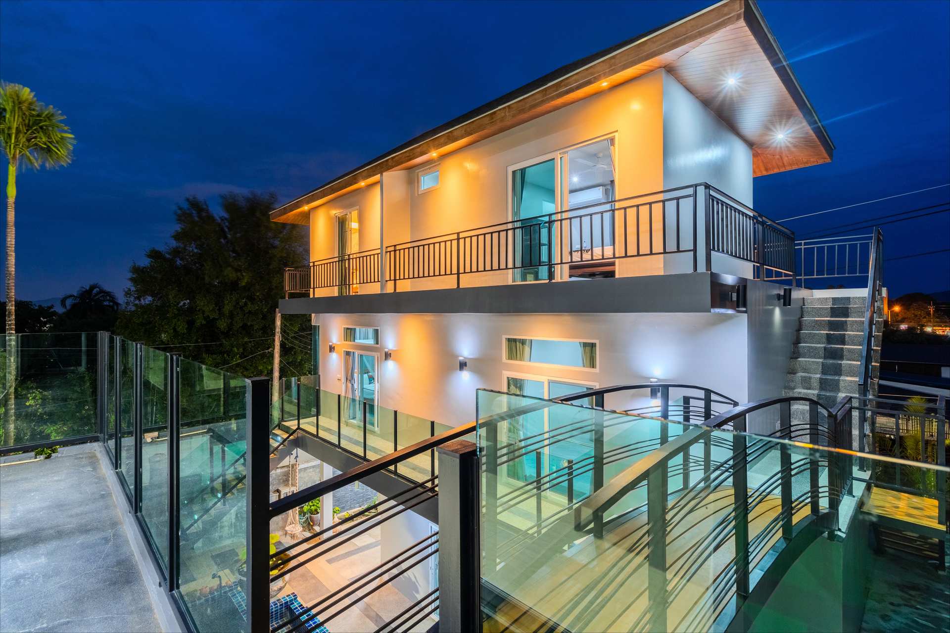 Rawai Estate Villa at dusk - a magnificent 10-bedroom luxury estate surrounded by tropical gardens in Rawai, Phuket, Thailand